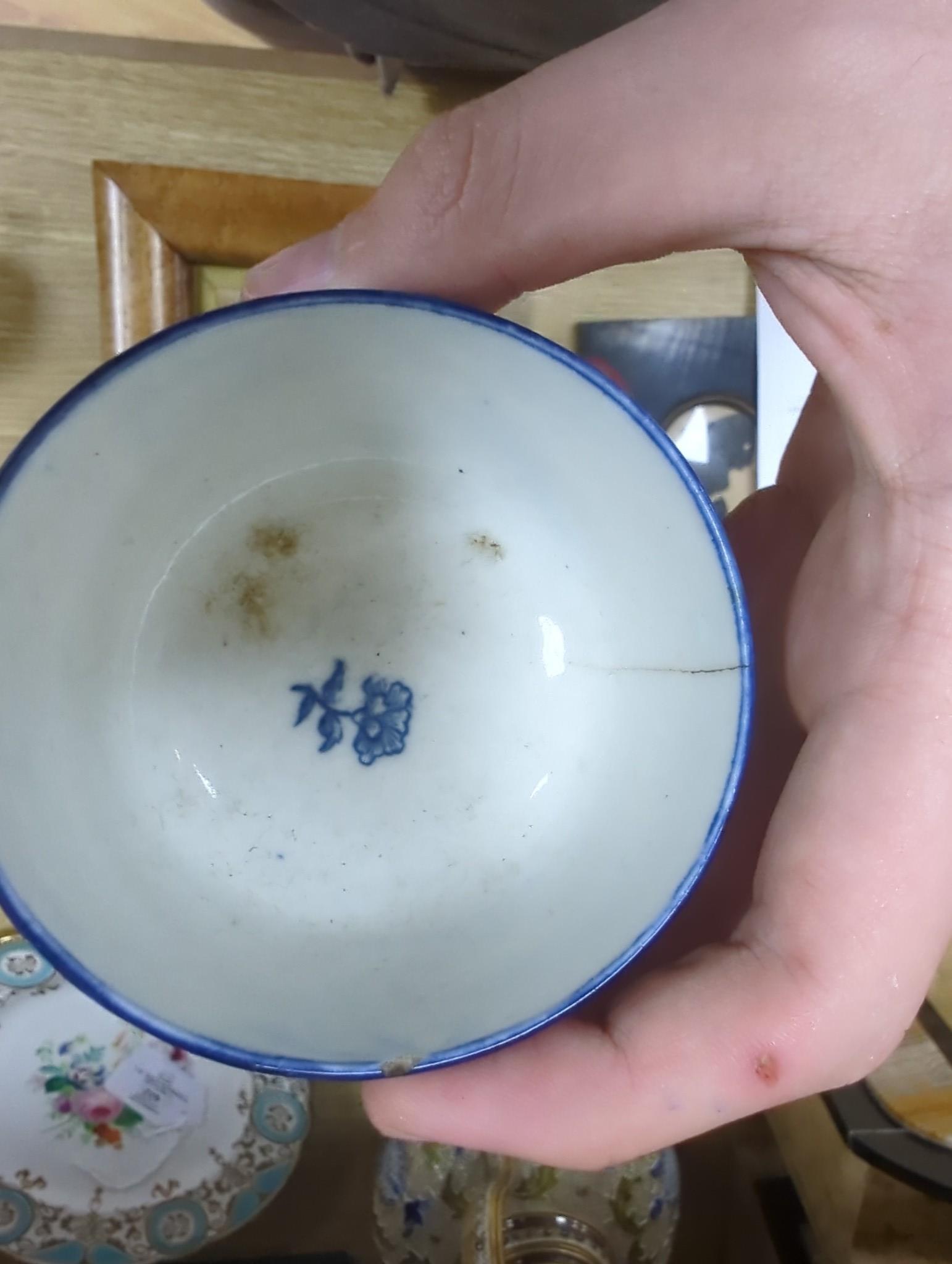 A large group of 18th century Worcester, Caughley and Liverpool blue and white tea bowls, coffee cups and saucers etc. including a Bow Cross-Legged Man